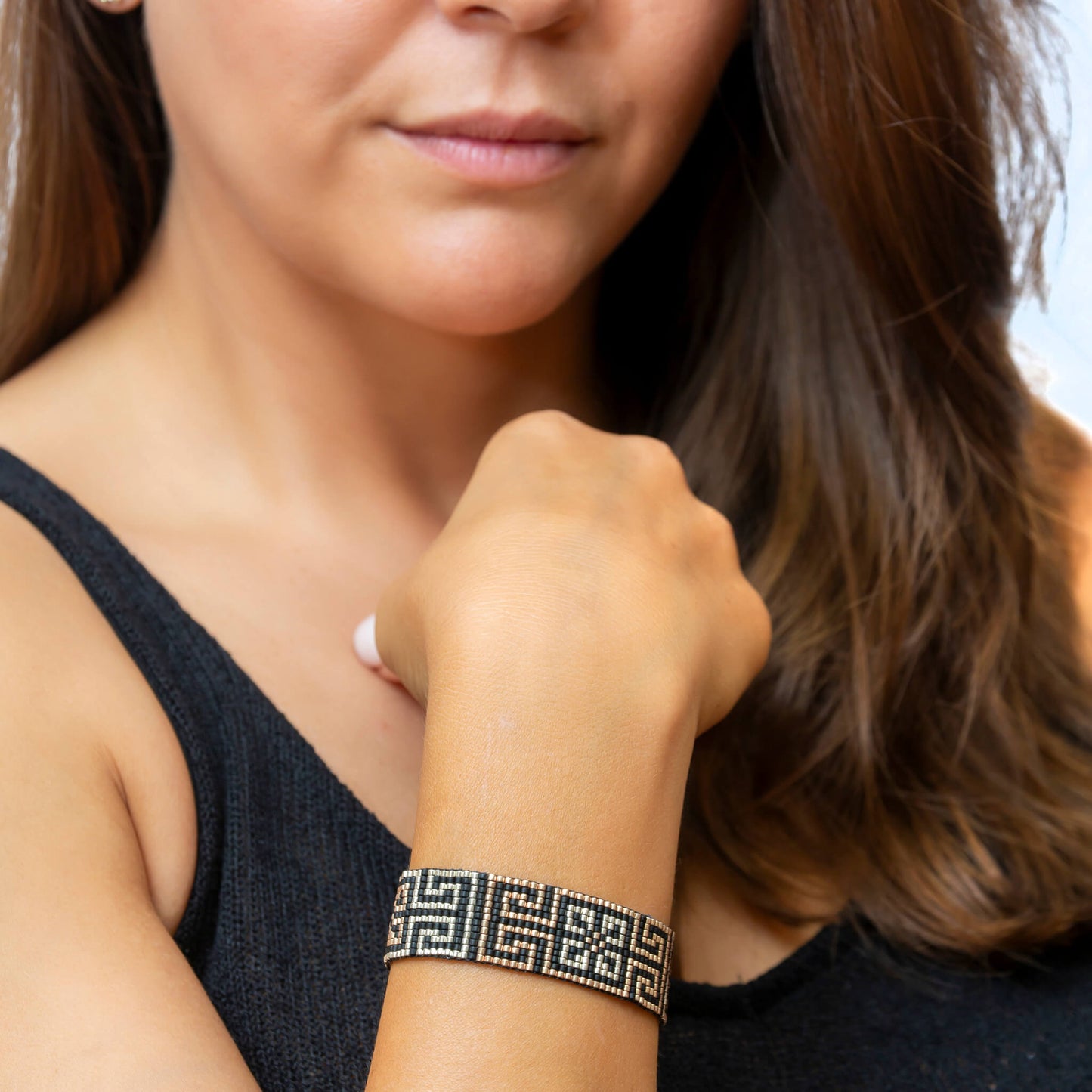 Road to Egypt bracelet showcasing a Tatreez pattern from Yafa and Ramallah in Black and gold and silver.