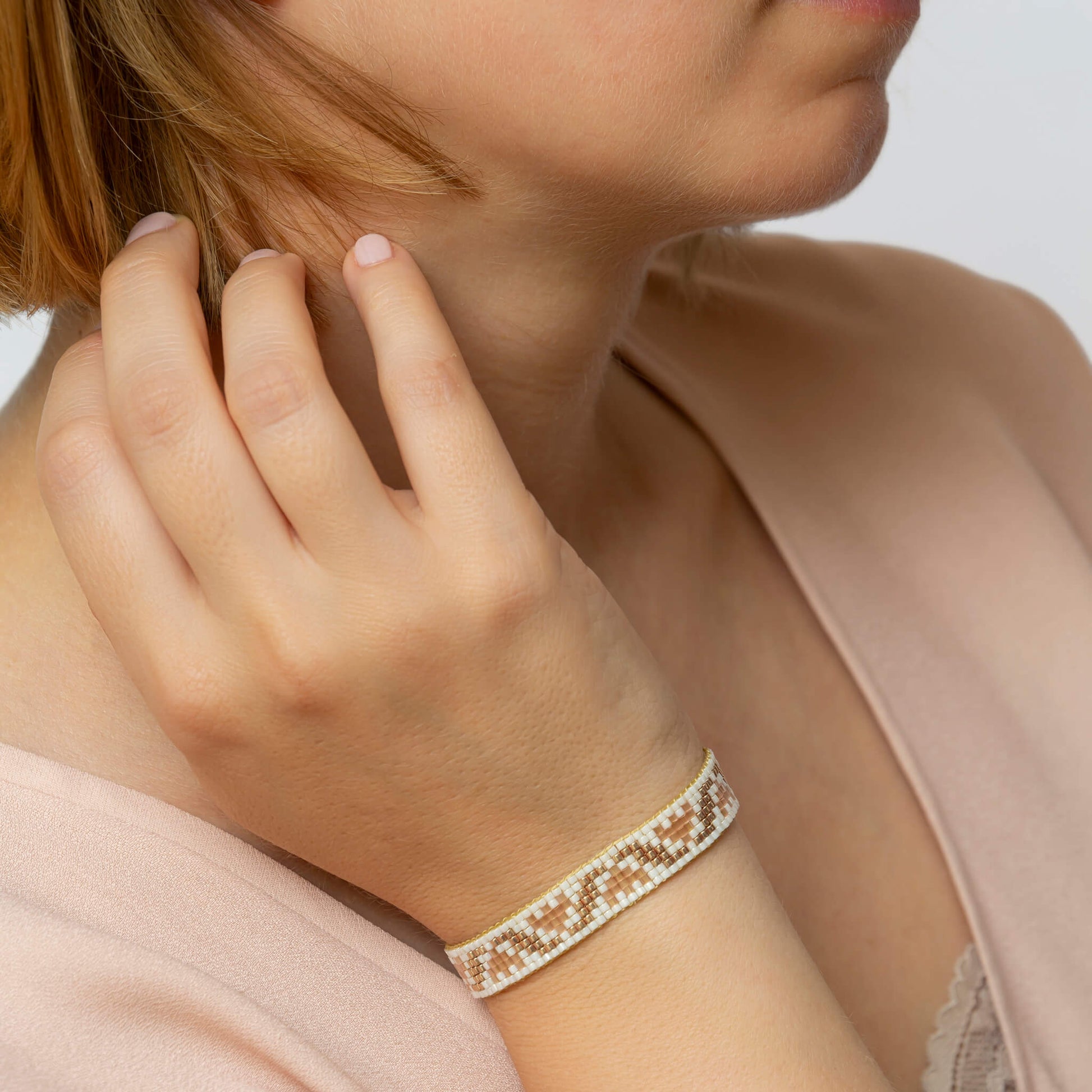 Tulips bracelet showcasing a Tatreez pattern from Ramallah in Pink Cream and Gold