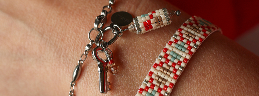 Close-up of red Palestinian tatreez embroidery highlighting traditional stitching patterns