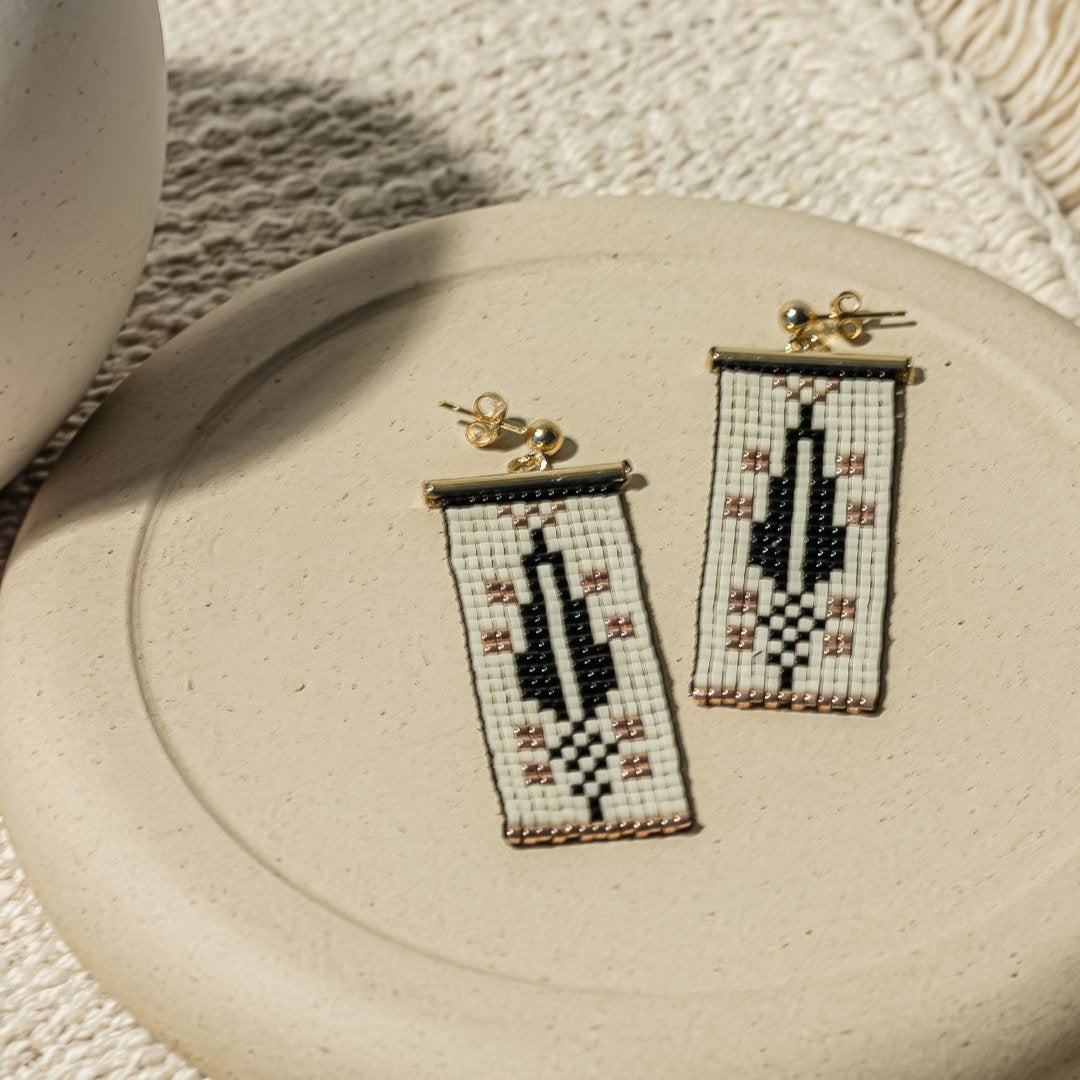 Cypress Earrings in Dark Cream highlighting the elegant design