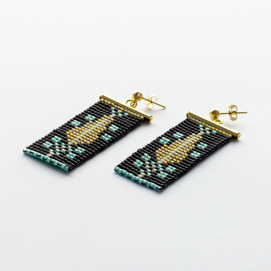 Close-up of Cypress Earrings in Green Turquoise - Highlighting vibrant green turquoise beads with warm amber accents