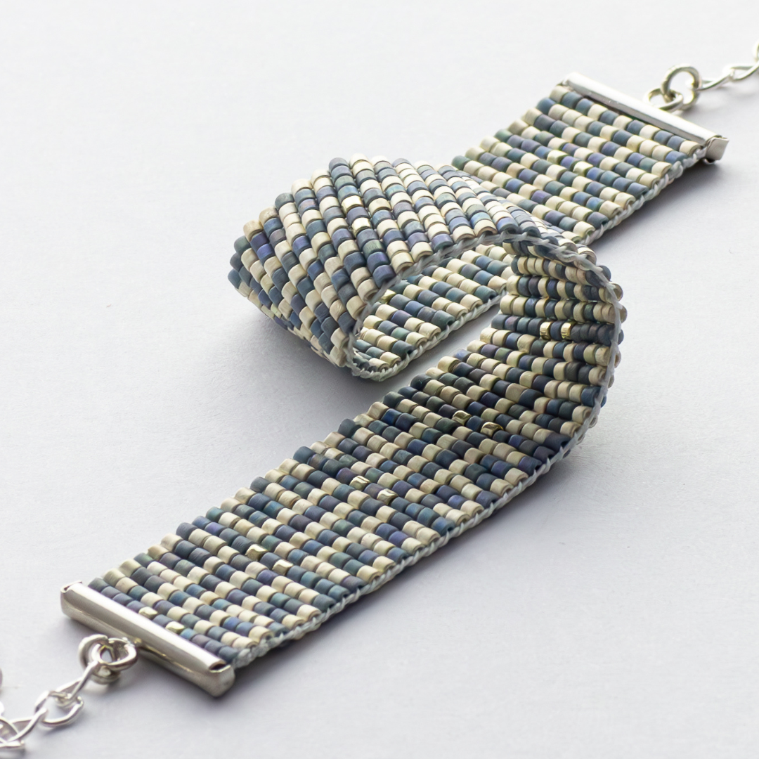 Chainmail bracelet showcasing a Tatreez pattern from Esdud in Moody Blue, Matt Silver and Shiny Silver