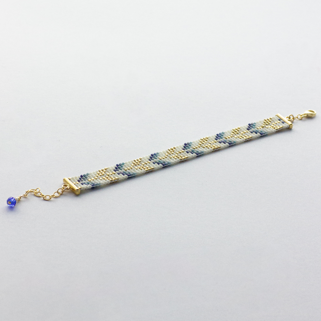 Trees bracelet showcasing a Tatreez pattern from Esdud in Blue and Navy and Gold