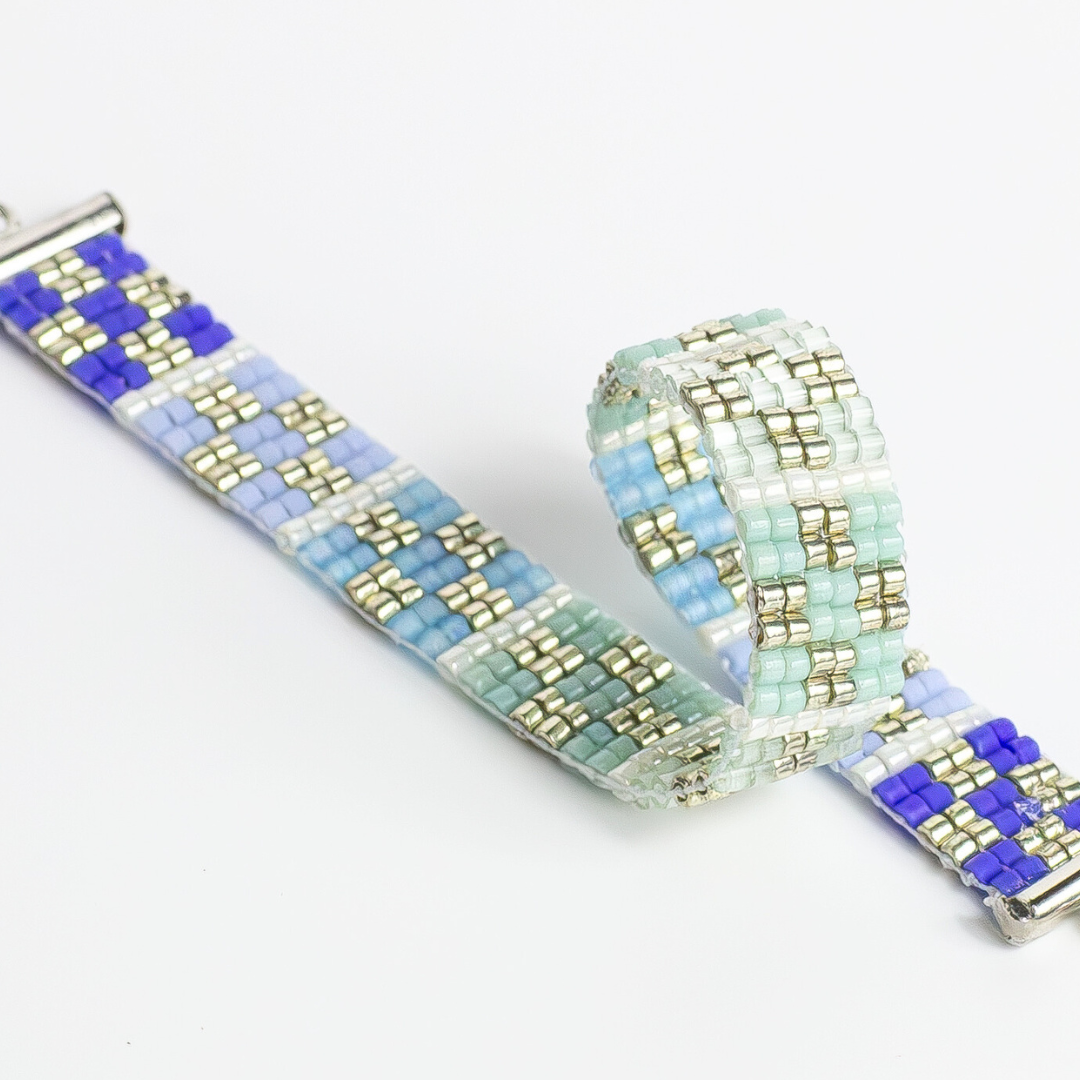 Bracelet with palestinian tatreez pattern from yafa in shades of green and blue