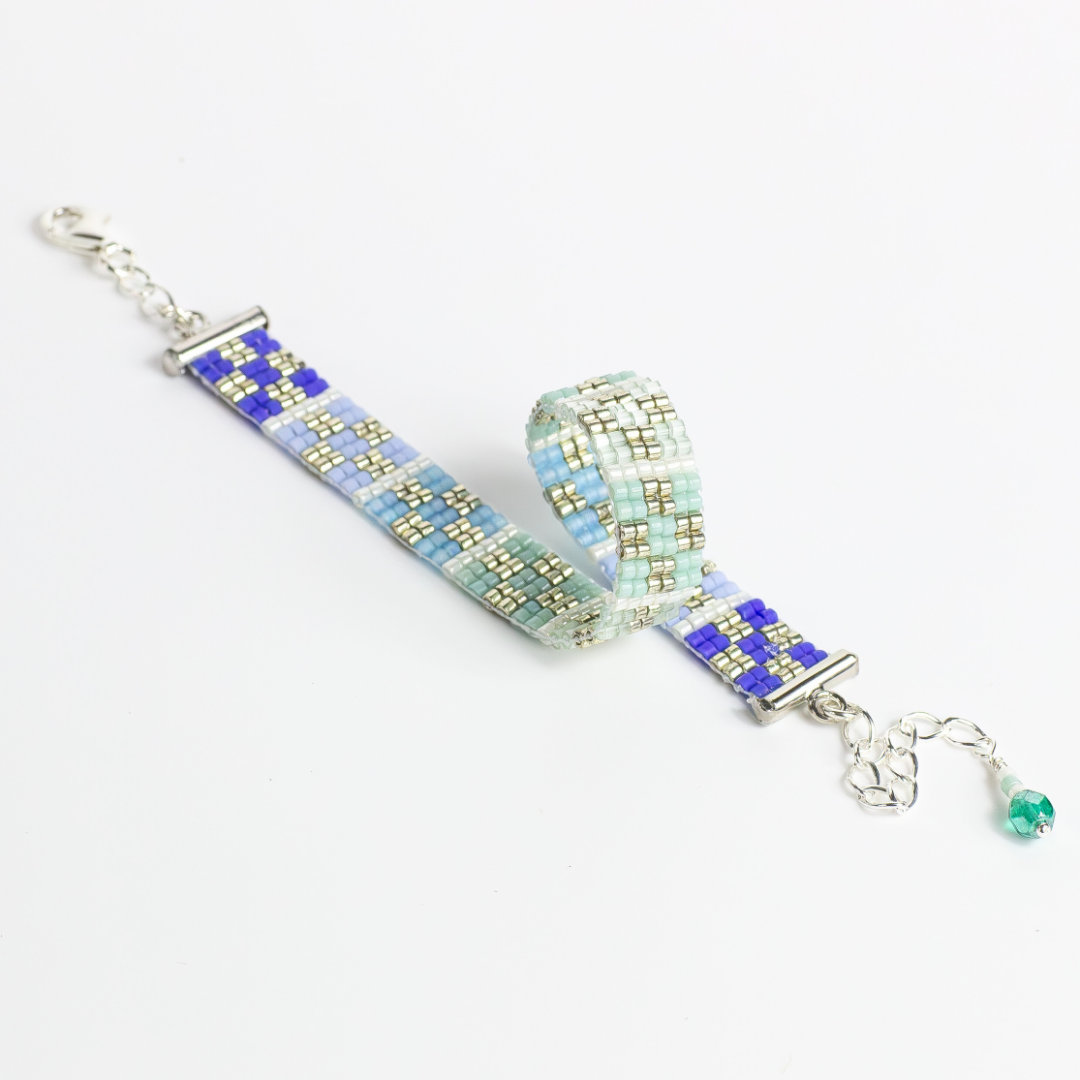 Bracelet with palestinian tatreez pattern from yafa in shades of green and blue