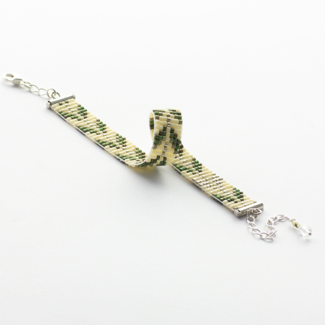 Trees bracelet showcasing a Tatreez pattern from Esdud in Olive Green and Silver