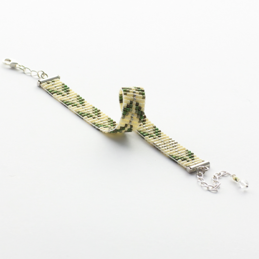 Trees bracelet showcasing a Tatreez pattern from Esdud in Olive Green and Silver