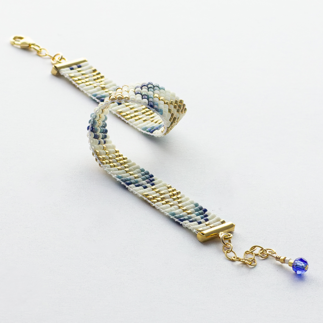 Trees bracelet showcasing a Tatreez pattern from Esdud in Blue and Navy and Gold