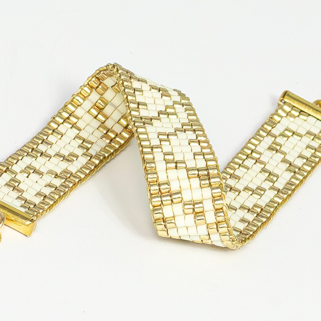 Tulips bracelet showcasing a Tatreez pattern from Ramallah in Cream and Gold