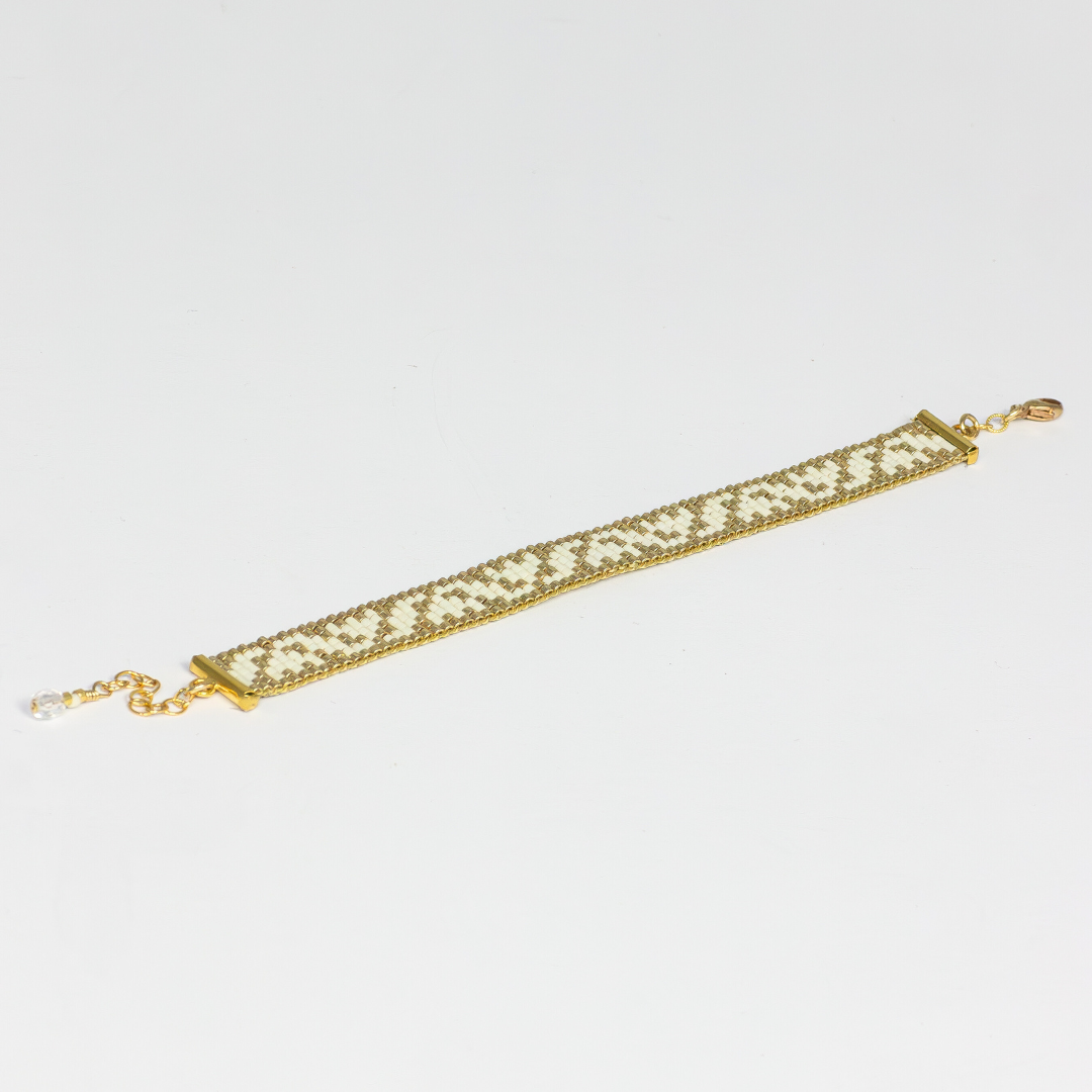 Tulips bracelet showcasing a Tatreez pattern from Ramallah in Cream and Gold