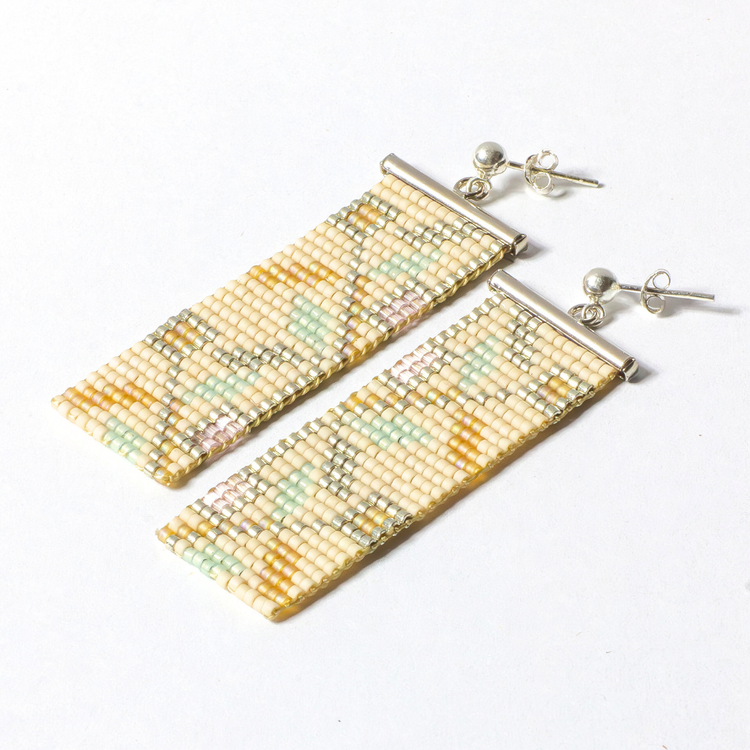 two handwoven earring photographed on a white background 
