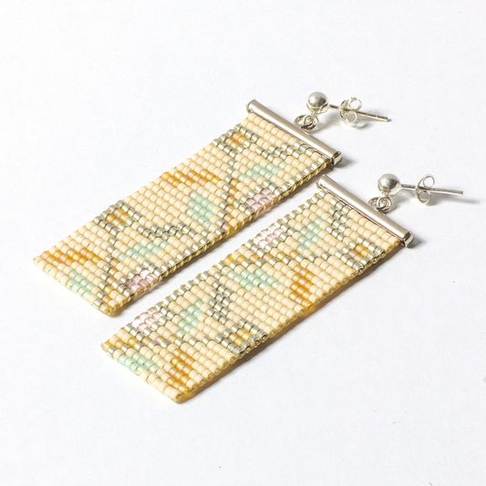 two handwoven earring photographed on a white background 