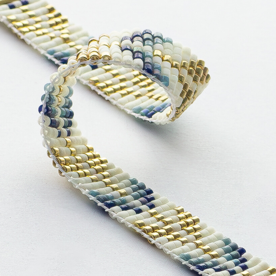 Trees bracelet showcasing a Tatreez pattern from Esdud in Blue and Navy and Gold